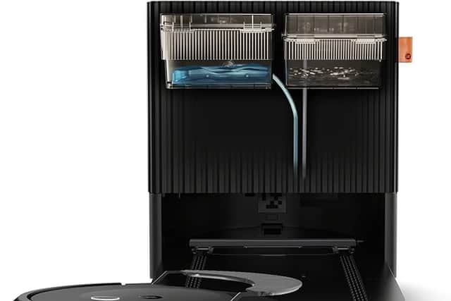 The Roomba Combo 10 Max base station empties the vacuum, then washes and dries the mop