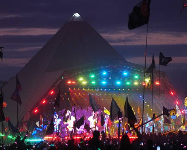 The crowd watching Coldplay performing on the Pyramid Stage at the Glastonbury Festival