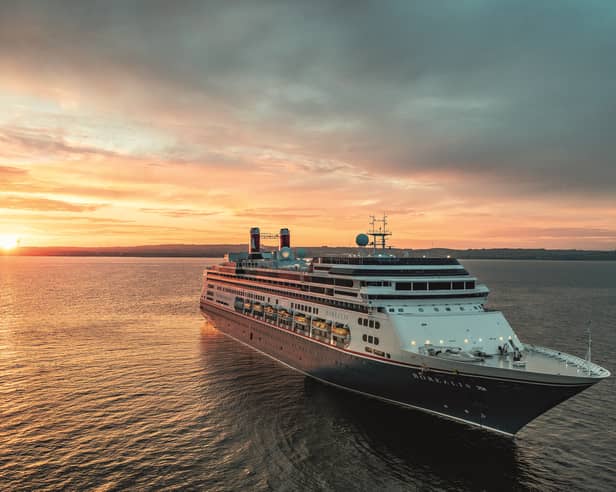 Borealis at sea at sunset