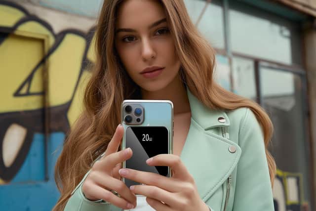 It can sit on the back of a phone and charge it while you move around