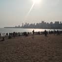 Families gather before sunset on Chowpatty beach in Mumbai