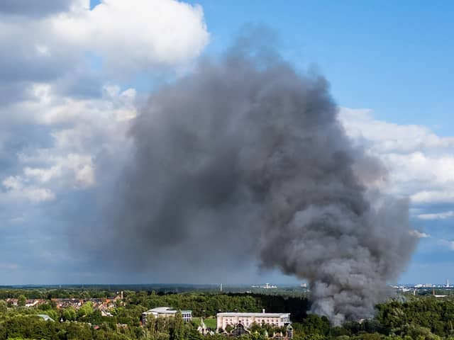 Smoke caused by a fire billows above the site of the Tomorrowland electronic music festival in Boom, northern Belgium on July 16, 2025.