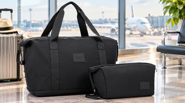 The Kono black expandable underseat cabin bag with cosmetic pouch and luggage strap