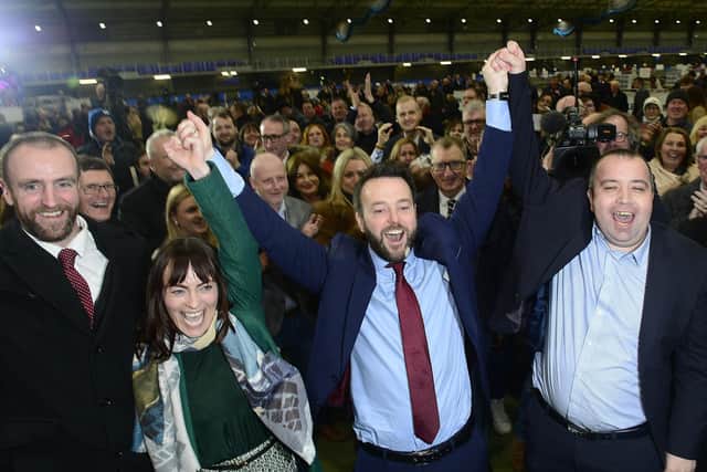 Colum Eastwood celebrates his electoral victory with MLAs Mark H. Durkan and Nichola Mallon and Councillor Brian Tierney.