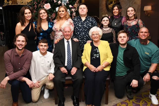 James and Celine McCarron pictured with their grandchildren at their 60th wedding anniversary celebrations in the Everglades Hotel. The couple were married in Saint Patrick's Chapel, Claudy on the 26th of December 1959. DER5119-118KM