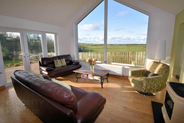 This luxury home offers pleasant views of surrounding countryside and partial views of the Atlantic Ocean.