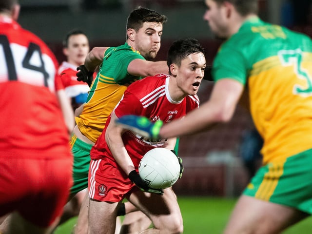Derry's Conor McCluskey tries to break past Donegal's Daire Baoill in Celtic Park on Wednesday night.
