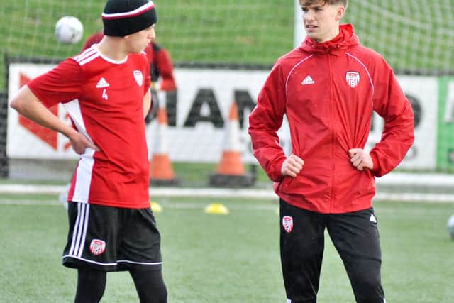 Derry City loan signing, Stephen Mallon has a chat with Ciaron Harkin during a training session at Brandywell.