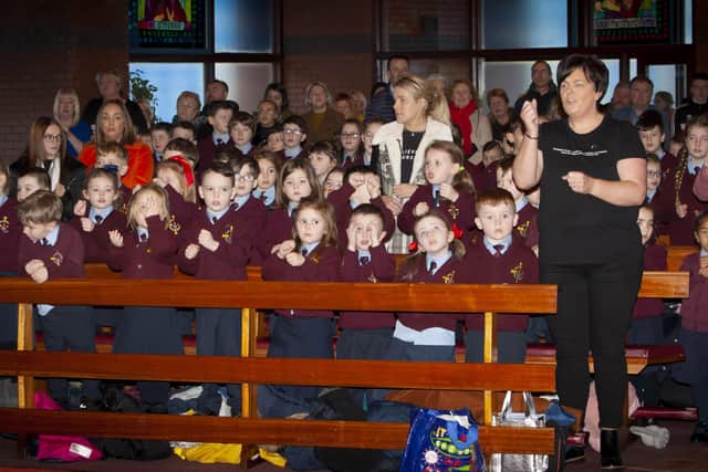 Pupils and teachers taking part in the singing during the 20th Anniversary Mass on Friday.