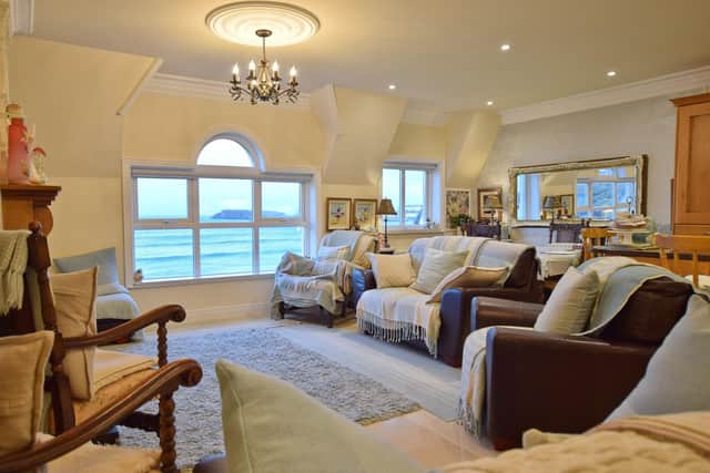 The property features an open plan kitchen with living and dining areas