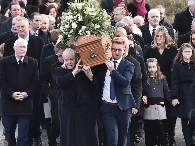 Mourners make their way to the chapel.