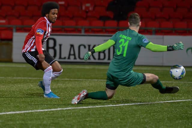 Derry Citys Walter Figueira beats Institutes keeper Rory Brown to score his first goal