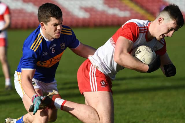 Derry's Shane McGuigan powers past Tipperary player Robbie Kiely in Celtic Park on Sunday. DER0720-103KM