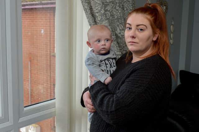 Bronagh Rogan and her four-month-old baby Finn pictured in their Gallaigh Park Home.  Bronagh’s blue bin was set on fire outside her front door on Friday night last by a group of young people. DER0920GS - 019