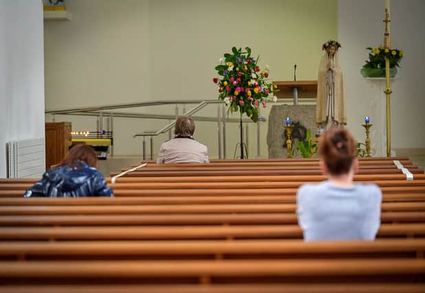 Parishioners at private prayer in St Mary’s Church, Creggan, recently.