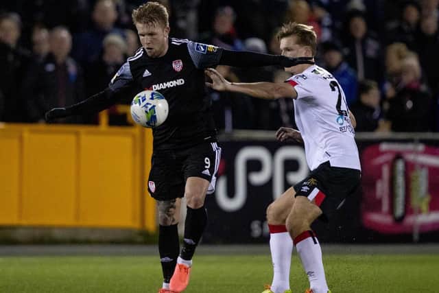Derry City striker Tim Nilsen holds off Dundalk centre-back Daniel Cleary, during the opening game of the season.