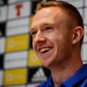 Shane Ferguson has extended his contract at Millwall.