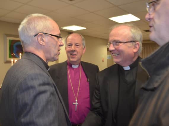 The Archbishop of Canterbury meets the two bishops during a visit to Derry in 2018.