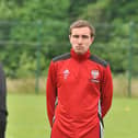 Derry City midfielder, Joe Thomson listens intensely to Derry City boss, Declan Devine during his first training session on Thursday.
