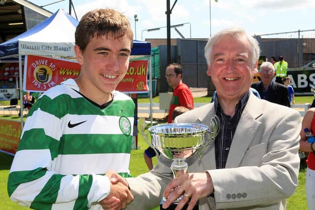 Edward McDaid, McDaid's Football Special, presenting the U14 Foyle Cup to Celtic captain Joe Thomson at the Brandywell Stadium in 2011.