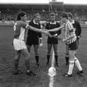 Cardiff captain, Terry Boyle exchanges pleasantries with Derry City skipper, Stuart Gauld prior to the scoreless draw at Brandywell.