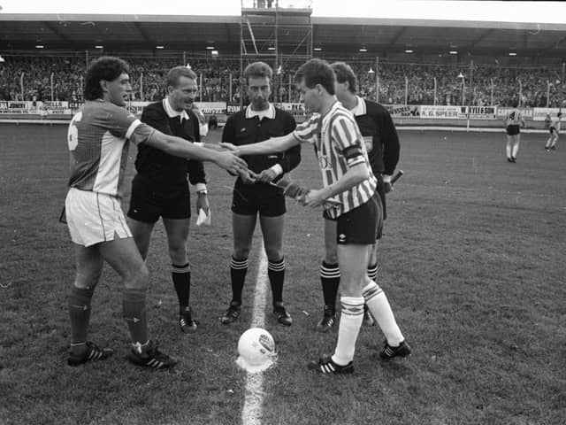 Cardiff captain, Terry Boyle exchanges pleasantries with Derry City skipper, Stuart Gauld prior to the scoreless draw at Brandywell.