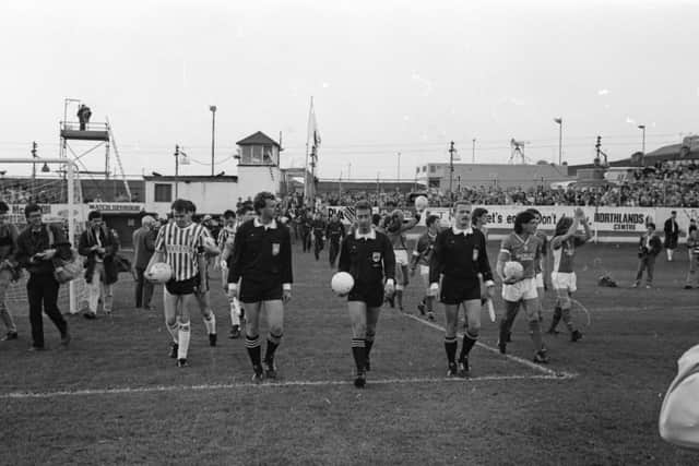 The Dutch match officials, referee John Blankenstein and linesmen, J.. Reygwart and Tim Van Riel leading the teams onto the pitch.