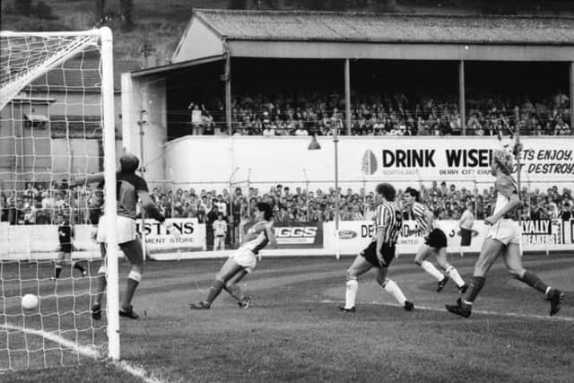 Cardiff City keeper, George Wood watches on as Noel Larkin's shot is snuffed out by the visiting defence.