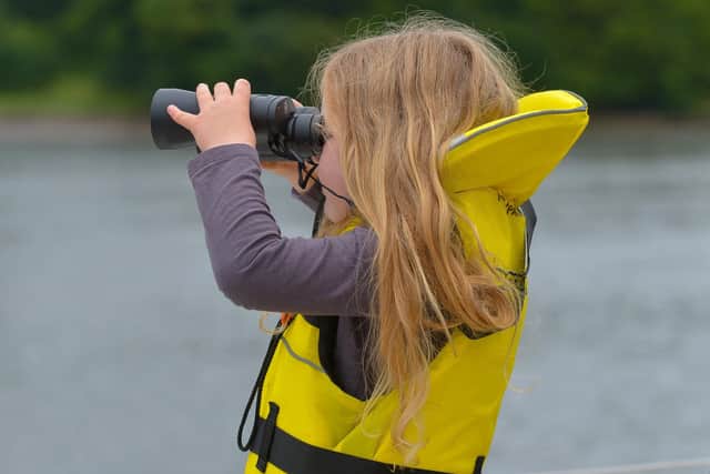 Rachel McCann, aged 5, looks out for Lough Foyle Yacht Club’s Garry Crothers who completed an epic voyage across the Atlantic arriving in Derry on Saturday afternoon last.  DER2027GS - 025