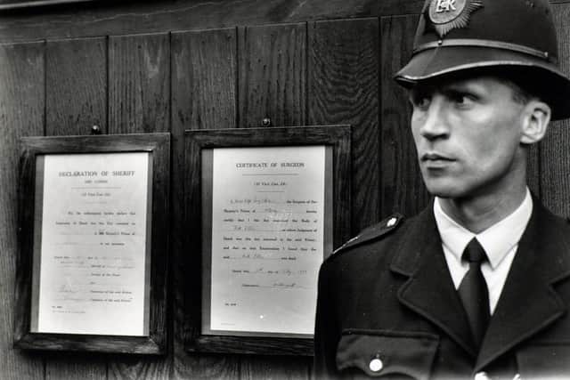 On the left, in a black wooden frame was the declaration of sheriffs. It read: We, the undersigned, hereby declare that the judgment of death was this day executed in Her Majesty Prison of Holloway in our presence. Dated this 13th day of July, 1955.