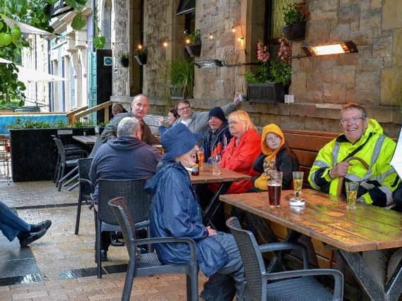 Customers pictured outside the Guildhall Taphouse on Friday afternoon last, DER2027GS  003