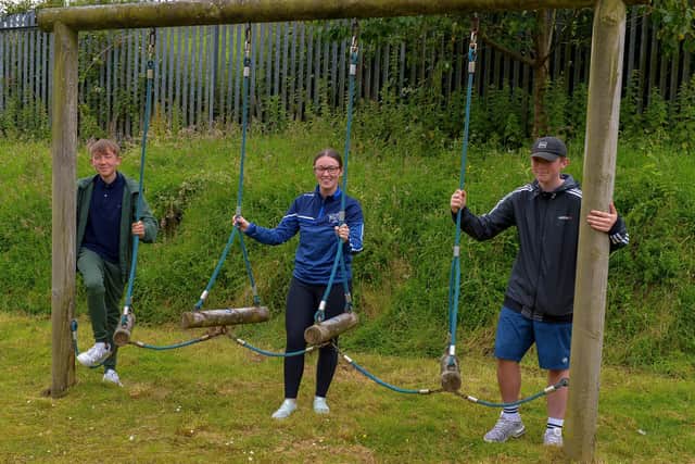 Cliona Young, youth leader at Creggan Youth Services pictured with Conghaile and Caoimhín during a clean-up and inspection at Creggan Country Park on Wednesday afternoon last.  DER2028GS - 003
