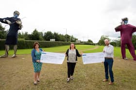 Former Derry City & Strabane District Council Mayor Michaela Boyle is pictured presenting cheques for £6,976.36 to her selected charities. Receiving the cheques are Marie Brown, Director of Foyle Womens' Aid and Adrian Loughrey, Koram Centre Manager.