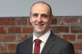 Mark H Durkan.