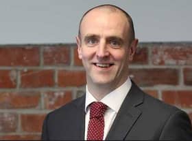 Mark H Durkan.