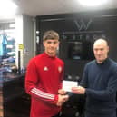 Derry City's Patrick Ferry receives the Watson Menswear Ulster Senior League Player of the Month award from Marty Fagan.
