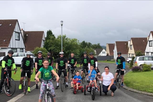 Ardnashee School and College teacher, Emma OKane (extreme right) pictured beside her son, Ryan, a pupil at the school,his brother and sister and the group of cyclists raising much needed funds for the school.