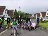 Ardnashee School and College teacher, Emma OKane (extreme right) pictured beside her son, Ryan, a pupil at the school,his brother and sister and the group of cyclists raising much needed funds for the school.