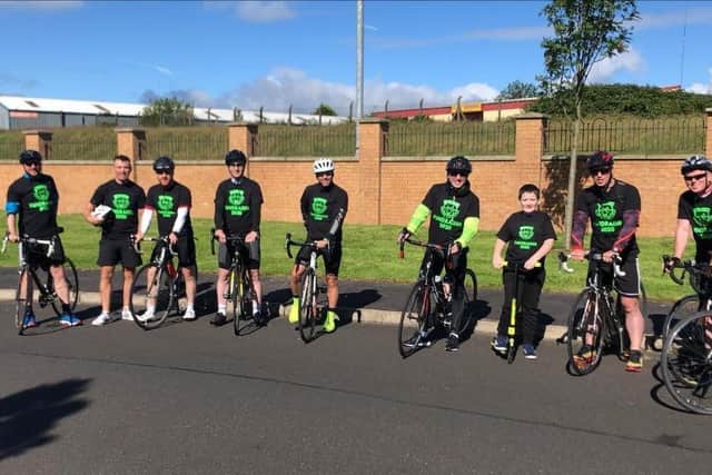 A group of cyclists taking part in a 16,000km charity cycle for Ardnashee School and College pay a visit to young Zach del Pinto on Saturday. From left to right are, Mark Crossan, Simon Collins, James McMonagle, Gary Curran, Marty McNutt, Ryan Magee, David Walker, John O'Connell and Dee O'Hare. Missing from photo is Darren Boyle.
