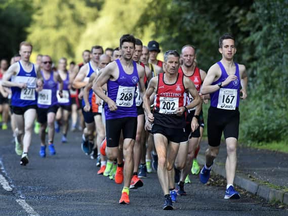 Gary Slevin, Declan Reed and Scott Rankin pictured at the front of the field during Dessie's Run last year.