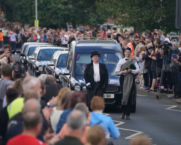 People line the streets as the funeral cortege of Jack Charlton passes through his hometown of Ashington, in Northumberland ahead of his funeral service at West Road Crematorium, in Newcastle