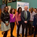 MARCH 4TH 2020: Judge Desmond Marrinan, Head of Review, pictured with members of the NW Migrant Forum, Paulette Mutiziztare, Aynaz Zarif, Lilian Seenoi-Barr, Forum Director, Tshamang Mushapo, Hyder Hasan, Yousuf Hassan and Tamal Simpson at the Review of Hate Crime Legislation Outreach Event held in the Guildhall on Wednesday evening .  DER1020GS – 010