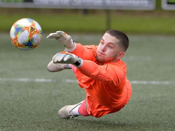 Institute goalkeeper Leannan McCann makes another top save in their Harry Cavan Youth Cup Final loss to Cliftonville Strollers.