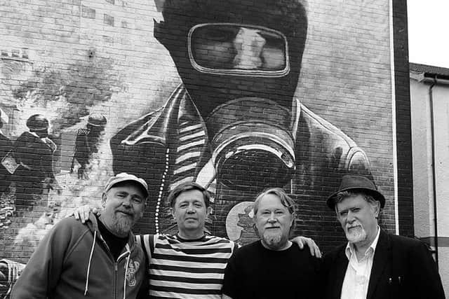 ICONIC... Paddy Coyle (second from left) pictured in front of the Rossville Street mural with Bogside Artists, Kevin Hasson, Tom Kelly and Willie Kelly.