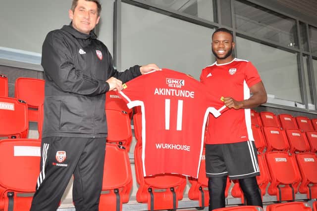 Derry City manager, Declan Devine pictured with new signing, striker, James Akintunde.