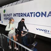 Travellers on their way to Turkey arriving at Belfast International Airport for their flight on Monday. Holidaymakers returning from Spain to Northern Ireland will have to quarantine for 14 days over a spike in Covid cases.