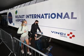 Travellers on their way to Turkey arriving at Belfast International Airport for their flight on Monday. Holidaymakers returning from Spain to Northern Ireland will have to quarantine for 14 days over a spike in Covid cases.