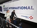 Travellers on their way to Turkey arriving at Belfast International Airport for their flight on Monday. Holidaymakers returning from Spain to Northern Ireland will have to quarantine for 14 days over a spike in Covid cases.