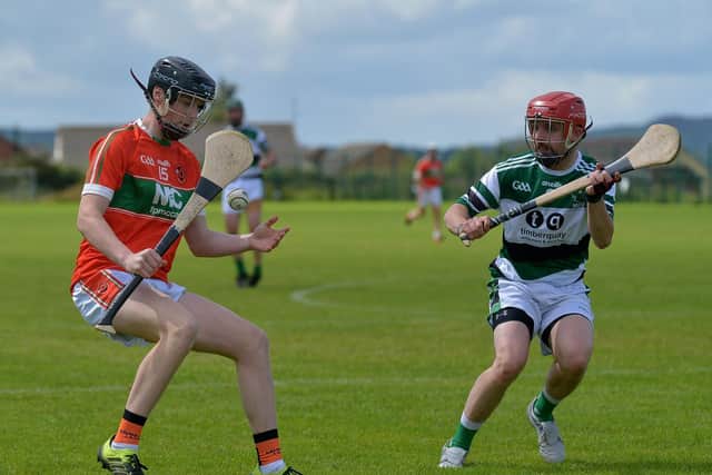 Laveys Ryan McGill is challenged by Na Maghas Robert Hegarty during the Senior Hurling Championship game held in Pirc Na Magha on Sunday afternoon last. DER2031GS - 008