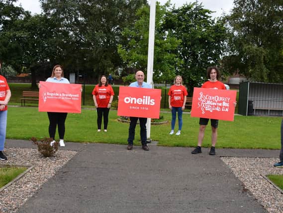 Launching the Colm Quigley 5k Jog in the Bog new O'Neill's t-shirt. Pictured,left to right are: Aisling Hutton, event organiser, Sinead Murphy, Catriona Gallen, Kieran Kennedy, Manager of O'Neill's International Sportswear, Aileen McGuiness, Manager of Bogside and Brandywell Health Forum, Danny Quigley, son of Colm Quigley, and Georgie Harkin.